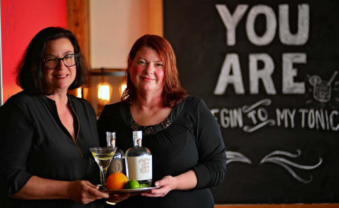 Stillwater co-owner and marketing manager Kim Seagram, and chief distiller and blender of Abel Gin Natalie Fryar with two craft Tasmanian gins.
