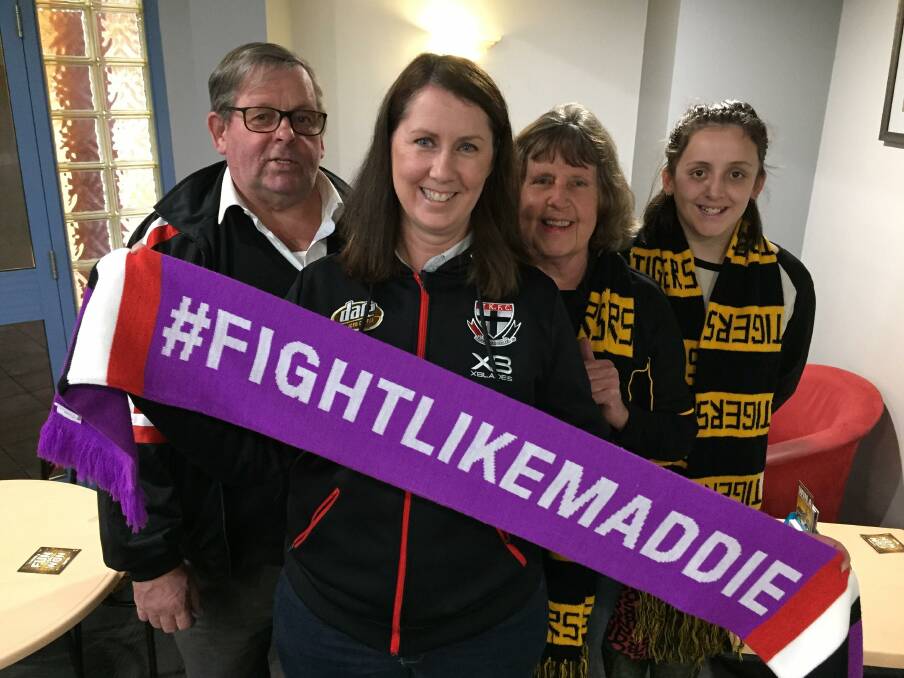 SUPPORT: Saints Supports Club president Robert Anderson and secretary Ree Smith with Richmond Supporters Club members Sandra Whiteley and Faith Willis. 