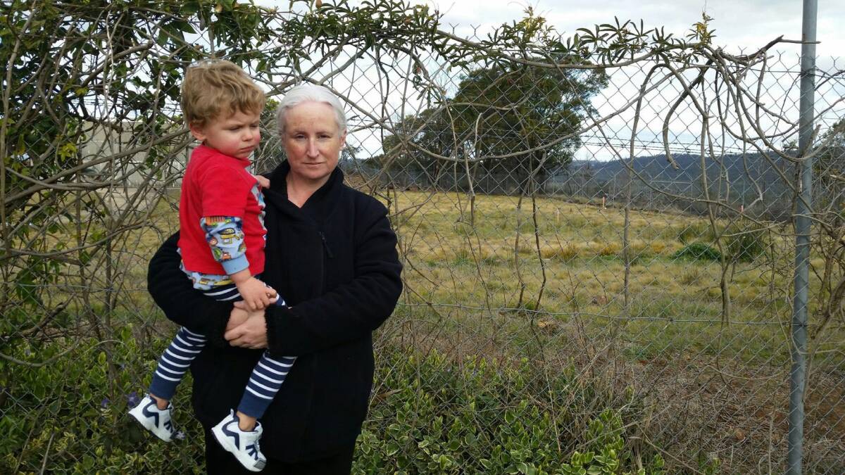 BACKLASH: Blackstone Heights resident Melissa Page and her son Elan McGhee stand at the site identified for a mobile phone tower. Picture: supplied