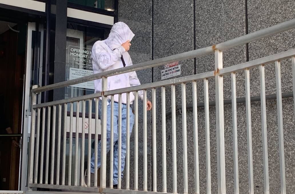 Dylan Lee covered his face with his hoodie as he left the Launceston Magistrates Court on Wednesday. Picture: The Examiner