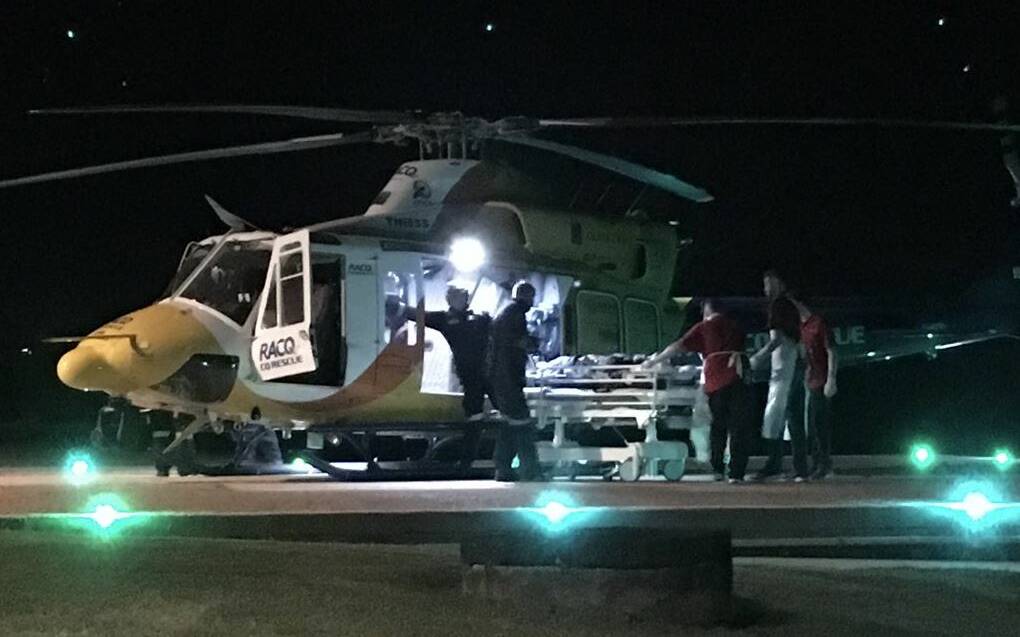 The RACQ CQ Rescue helicopter lands at Mackay Base Hospital with the shark attack victim. Picture: Olivia Grace-Curran - Nine News Queensland