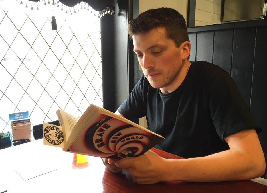 CONVERSATION: Tough Guy Book Club Launceston president Pod Pickering enjoying a beer while delving into some literary greatness. Picture: Sarah Aquilina
