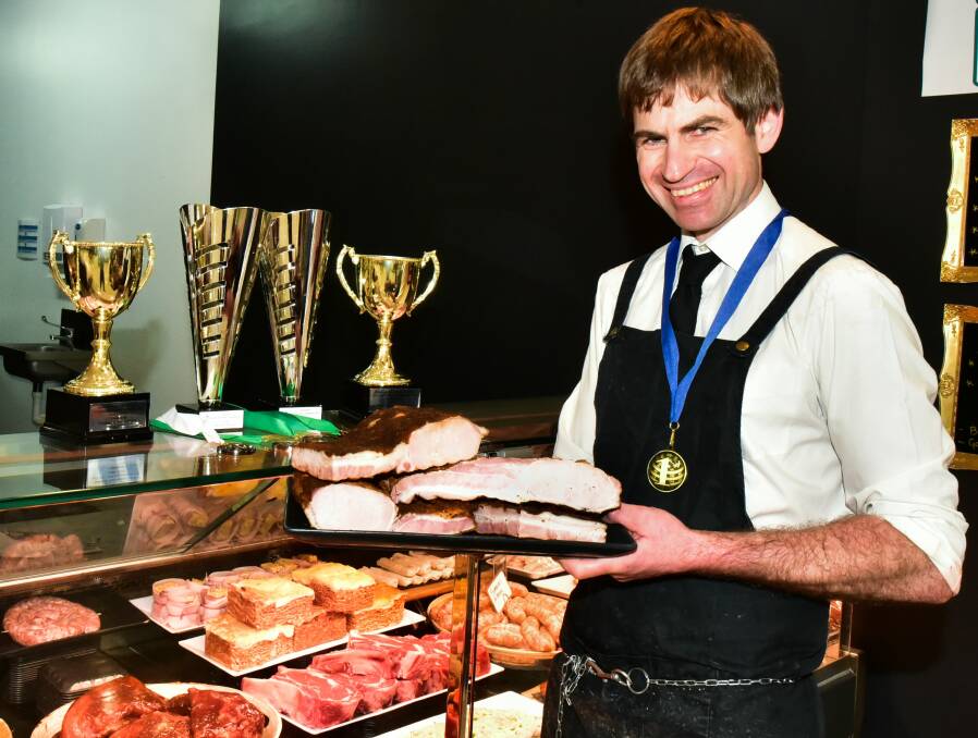 FIRST PLACE: Nigel’s Gourmet Butchers owner Nigel Birrell with his award-winning bacon. Picture: Neil Richardson