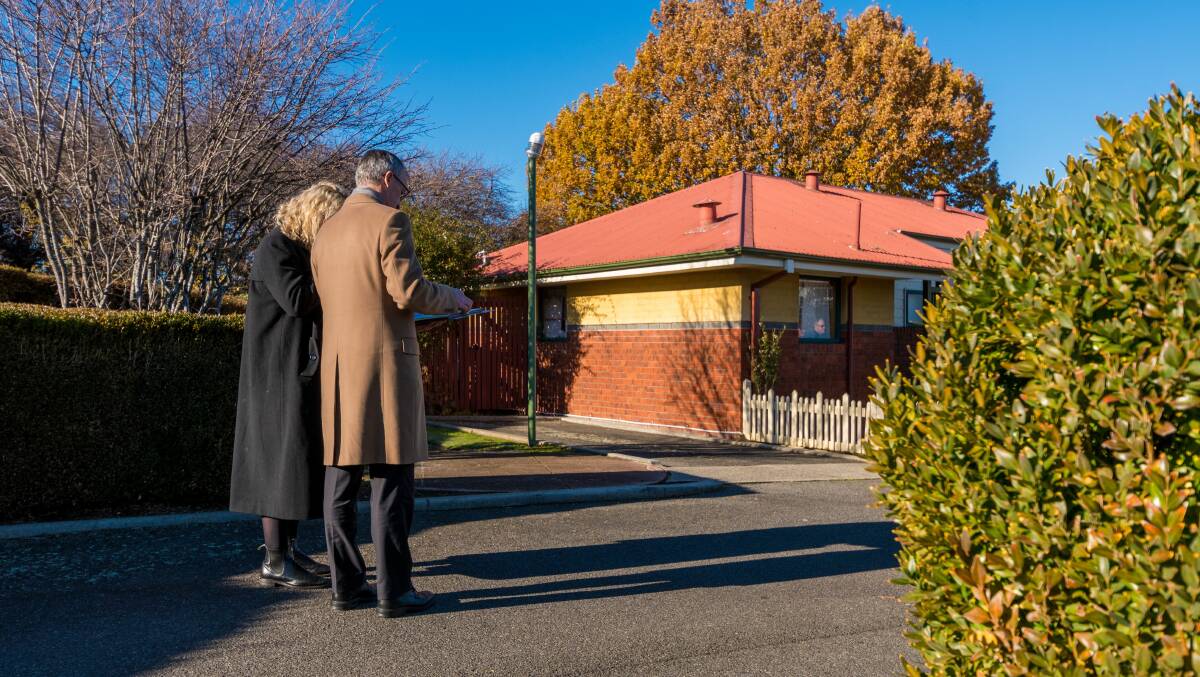 Justice Robert Pearce (right) with his associate Alice Croft at the Parklands Parade unit where Bradley Breward was allegedly killed. Picture: Phillip Biggs