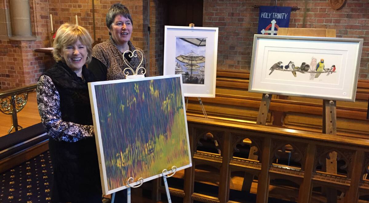 WINNER: Launceston Art Society president Carolyn Riley and coordinator Carlene Bullock with winning work Sundance by Lynne Kelly. 