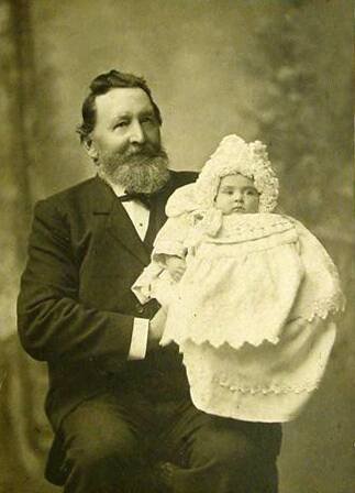 MINING INTERESTS: Launceston Fire Chief Robert Bennell (here with a grandchild) brought back ore samples in his saddlebags for crushing at the hotel. He had many interests in tin and gold, including as a partner in the Industry mine. (The Bennell family)