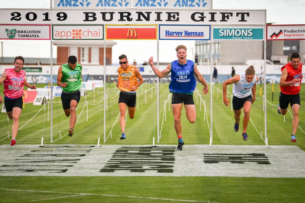  FUTURE STAR: Ash Moloney (in the blue) crosses the line to win the Burnie Gift at West Park. Picture: Simon Sturzaker