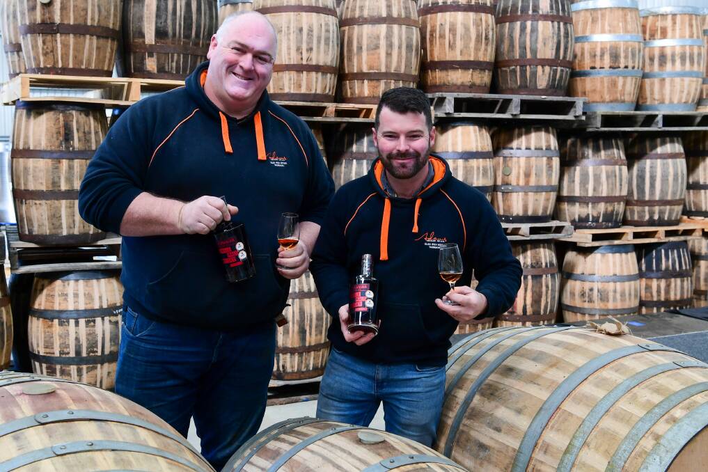 TOP CLASS DROP: Adams Distillery owners Adam Pinkard and Adam Saunders with their top class whisky. Picture: Neil Richardson