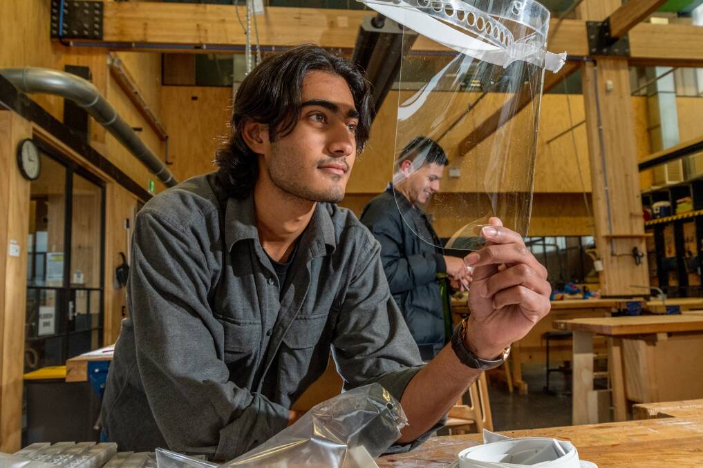 TEAM EFFORT: Hamza Iqbal and William Rojas are among UTAS architecture students making PPE face shields. Picture: Phillip Biggs.