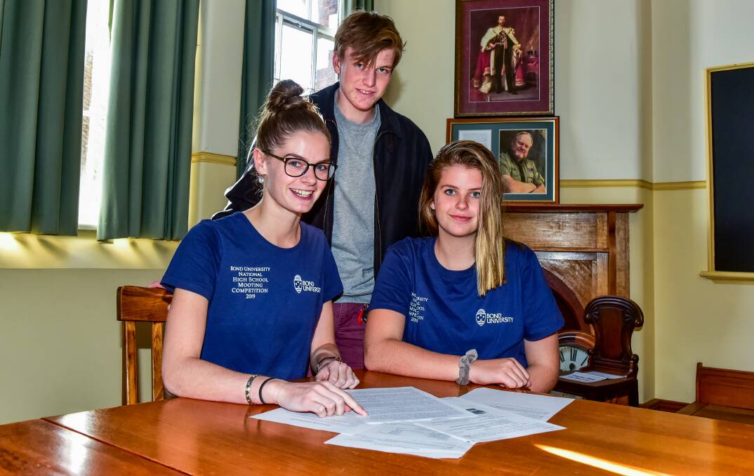 ORDER: Launceston College students Anna Roberts, Marley Seckold-Bamford and Eleanor Riley who competed in a mooting competition recently. Picture: Neil Richardson