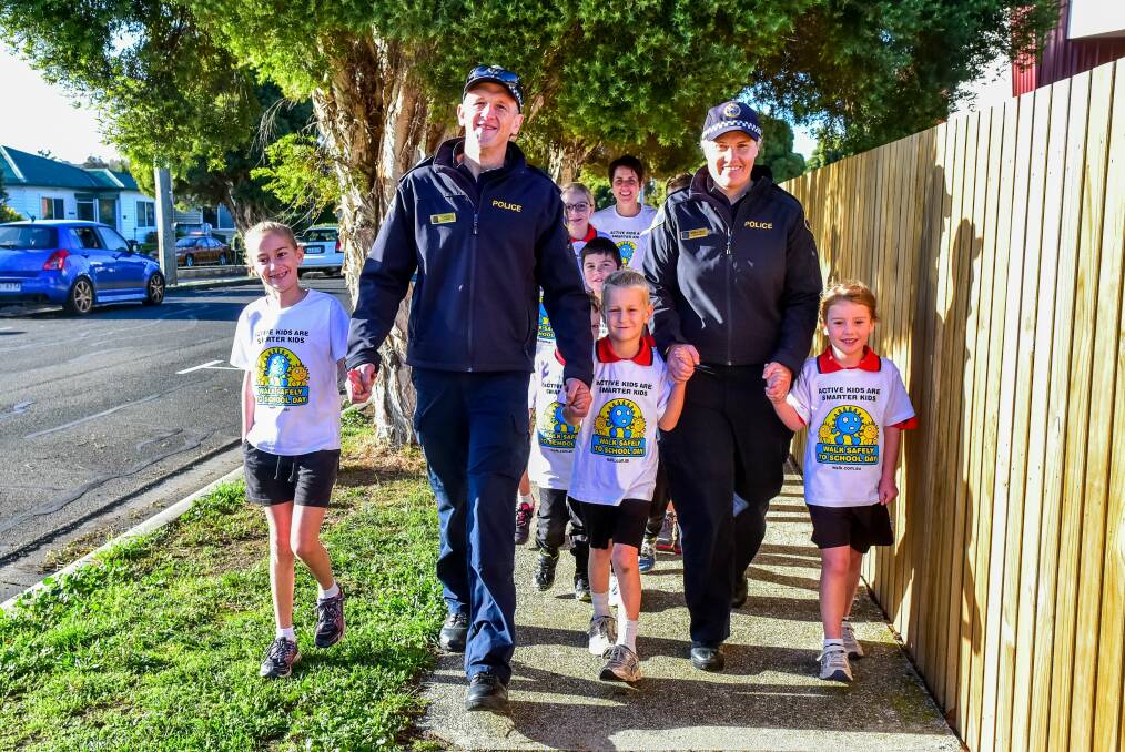 SHOES ON: Tasmania Police Constables Deon Johns and Tarnya Frost with Newstead Christian School pupils Hadassah Spark, Sebashian Spark and Isla Nugteren. Picture: Neil Richardson