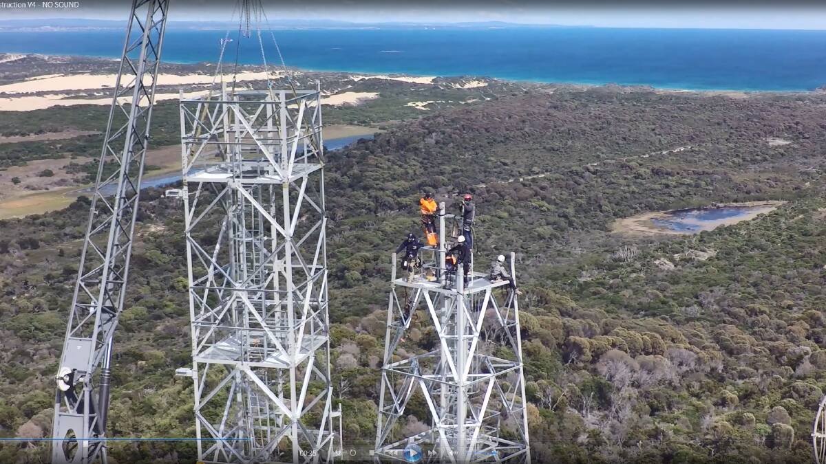 NICE VIEW: Telstra engineers work on the 80-metre high tower at Waterhouse. Pictures: supplied