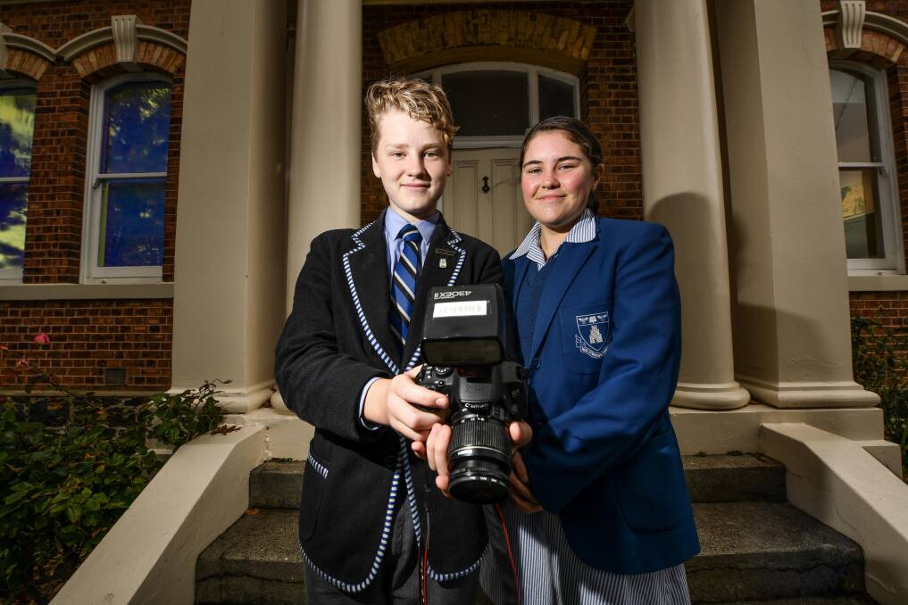 BUDDING SNAPPERS: Launceston Church Grammar year nine students Will Bates and Isobel Goss get ready for the Snap photographic scavenger hunt. Picture: Scott Gelston 