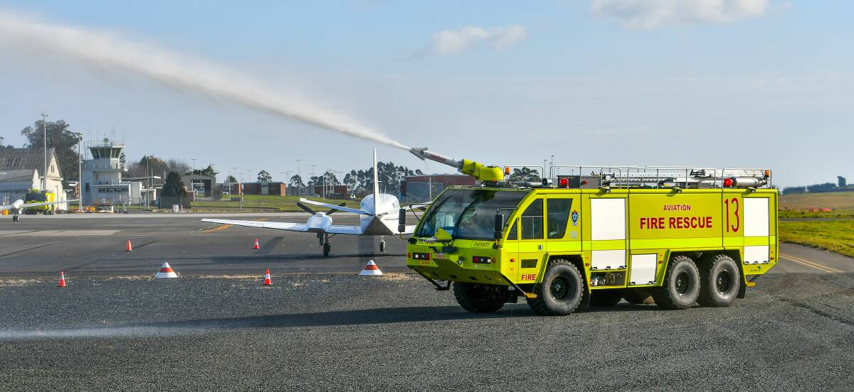 TRAINING: Aviation Firefighters working at the Launceston Airport emergency management exercise at Western Junction. Picture: Scott Gelston