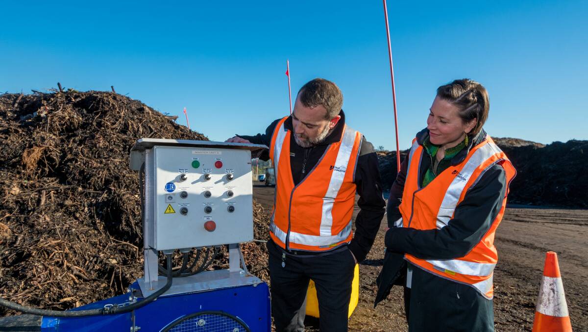 STREAKS AHEAD: City of Launceston Council waste management officer Michael Attard and natural environment officer Michelle Ogulim at the FOGO station. Picture: Phillip Biggs