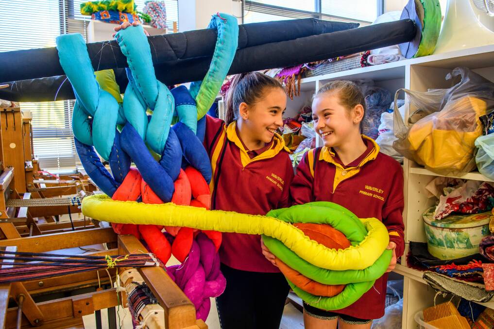 FIBRE FUN: Waverley Primary School pupils Ella Bishop and Kiara Butwell with some oversized wool and needles. Picture: Scott Gelston