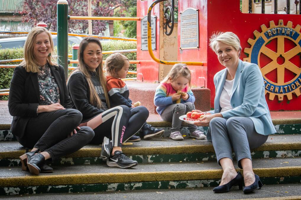 MORNING TEA: Tasmanian Labor leader Rebecca White with deputy leader of the Australian Labor party Tanya Plibersek, and Ali Sharock and son Louie, 1, of Launceston, and Annie, 3 spruiking the school lunches policy. Picture: Paul Scambler