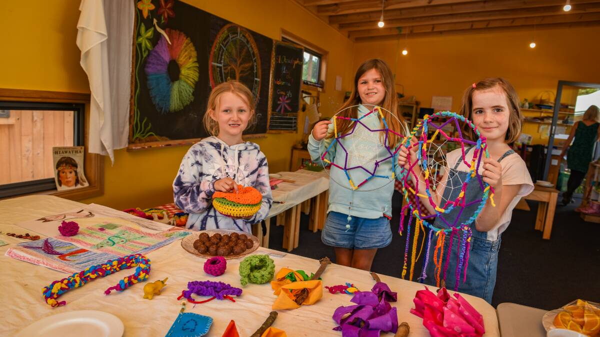 Amelia Buchanan, Charlotte Holland and Tilly Butchart show off their dream-catcher creations at the Tamar Valley Steiner School at St Leonards, Launceston. 