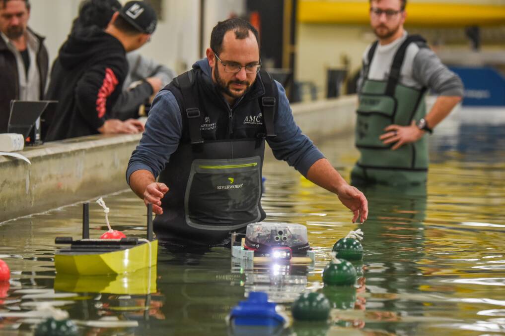 AMC Lecturer Dr Jean-Roche Nader tests a craft built and designed by students as part of a challenge held at the model test basin.
