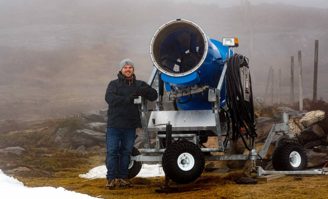 LET IT SNOW: Ashley Howard with a snow gun on Ben Lomond. A feasibility study into the viability of snow making will be undertaken by GHD. Picture: Philip Biggs