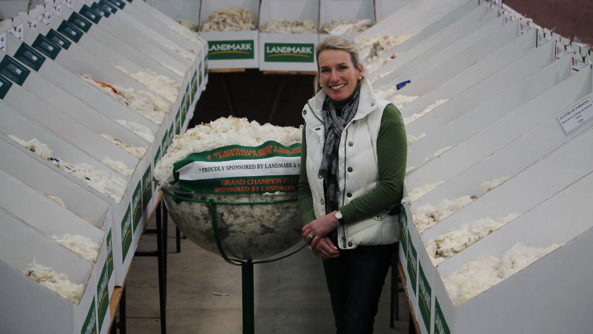 HISTORY: Ross sheep producers Georgina Wallace with her grand champion fleece at Bendigo. Picture: supplied