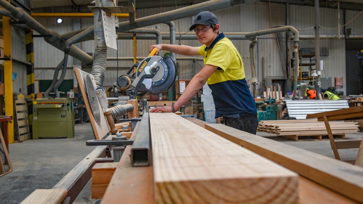 Andrew Narracot, 15, of Queechy High works on a saw in the workshop at Rocherlea.