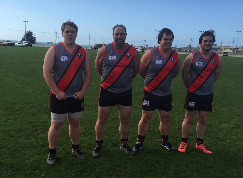 KICKING GOALS: South Riana dairy farmer Wayne Saward (second from left), 45, played his last game of local football for Yeoman Football Club with his sons Sam, Damien and Alex. Picture: Supplied