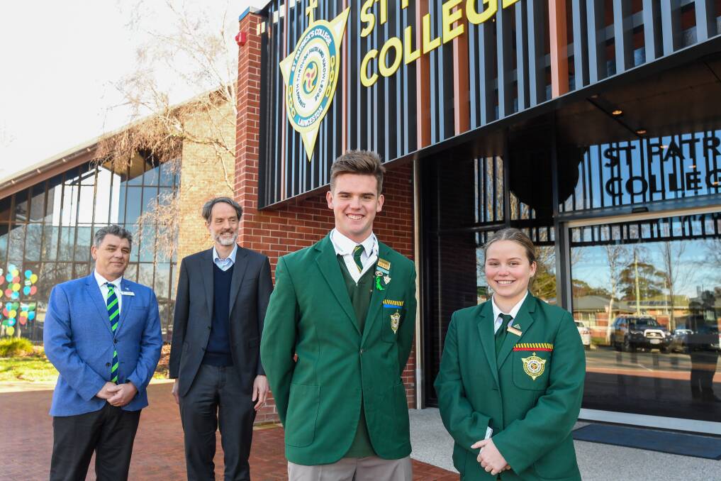 FUTURE PLAN: St Patrick's College year 12 students Tom Dwyer and Kate Macdonald with principal Tony Daley and University of Tasmania vice-chancellor Rufus Black. Picture: Neil Richardson 