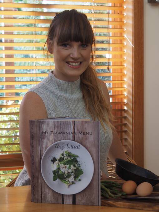 Former TV cook Amy Luttrell with her cookbook.