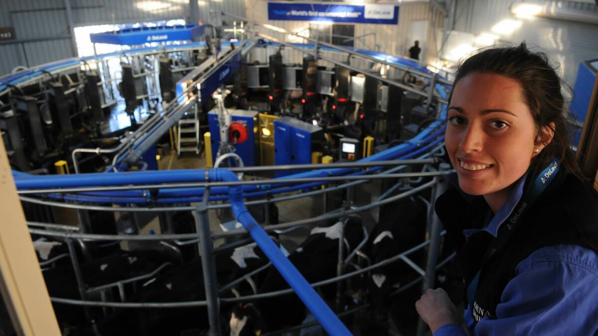 MECHANIC HELP: Rebekah Dornauf with Gala Farm's robotic rotary or automatic milking rotary system. Picture: file