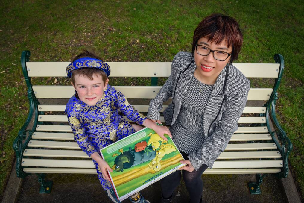 IMMERSIVE: Launceston boy Ellis Hookway and researcher Vinh To; Elias was one of the children involved in the study. Picture: Paul Scambler