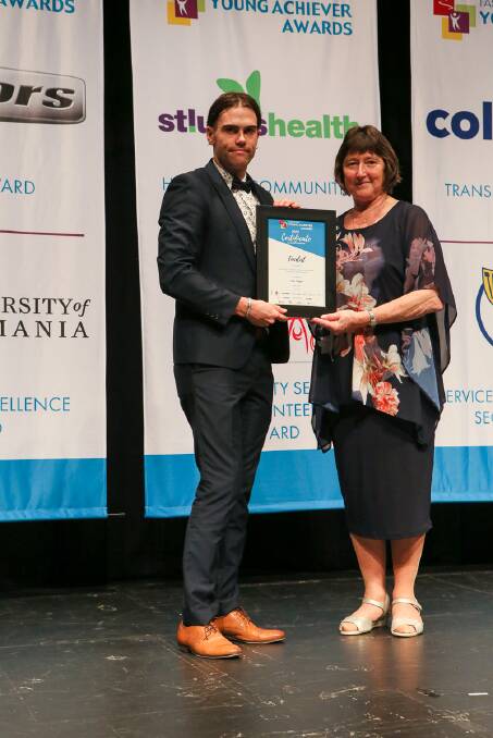 Mr Tepper receives his finalist certificate at the Tasmanian Young Achievers gala ball and award night in May.