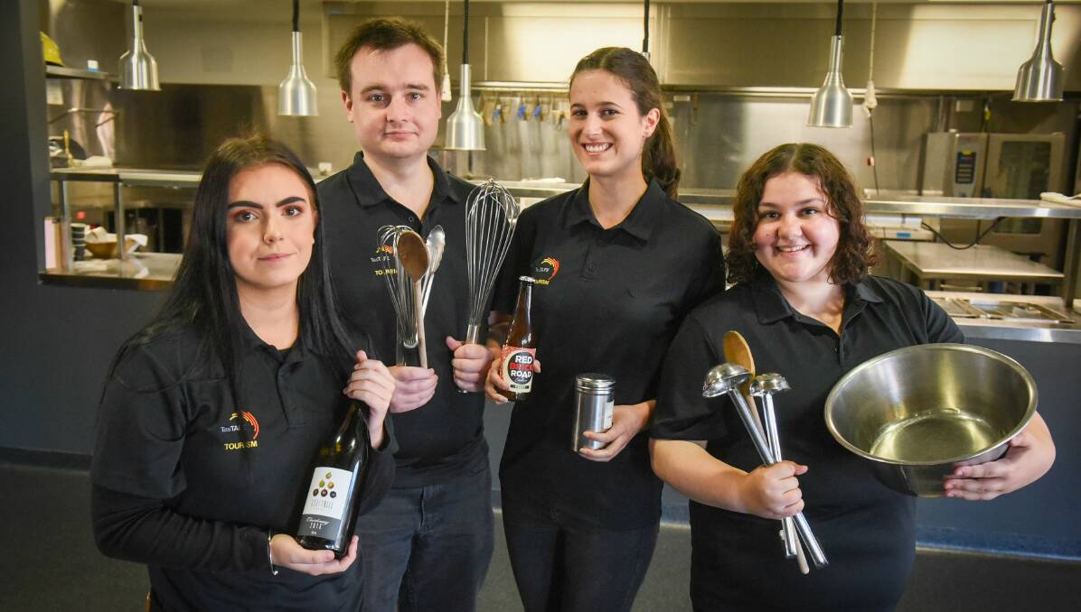 DELICIOUS: TasTAFE Tourism Certificate III students Nikita Cooper, Simon Welch, Mae Donald and Skye Cusak prepare for the Drysdale Swill and Swine event on May 17. Picture: Paul Scambler