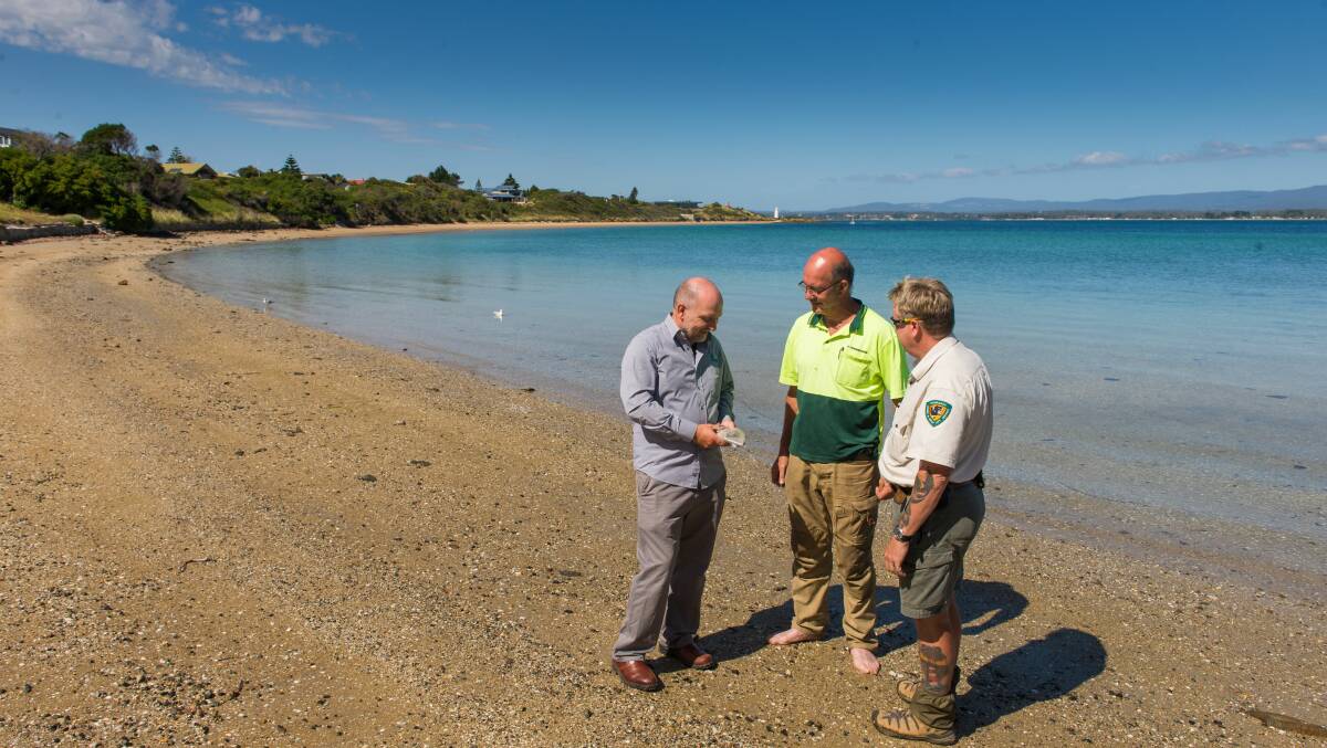 C2 Demolition asbestos removalist Bob Brinkman, Environmental Service and Design Environmental Consultant Rod Cooper, Crown Land Services Regional Property Officer Phil Thompson on the beach last week. Picture: Phillip Biggs