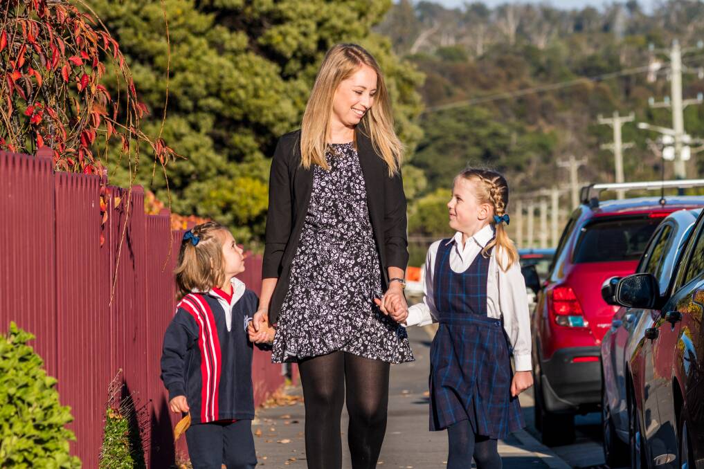 Hannah Osborne with her children Ivy and Lily at Youngtown Primary School.