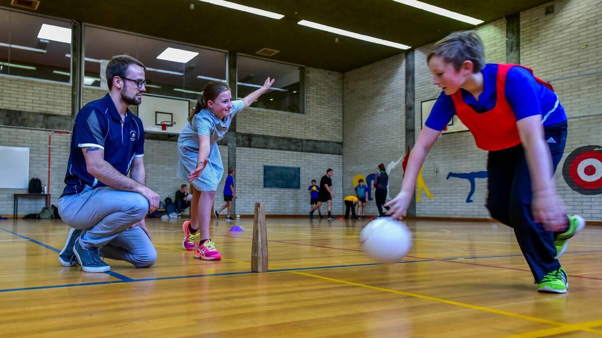 MOVEMENT: Mowbray Primary School pupils Taylah Barnes and Riley Pills under instruction from student teacher Patrick Sauerwald. Picture: Neil Richardson 