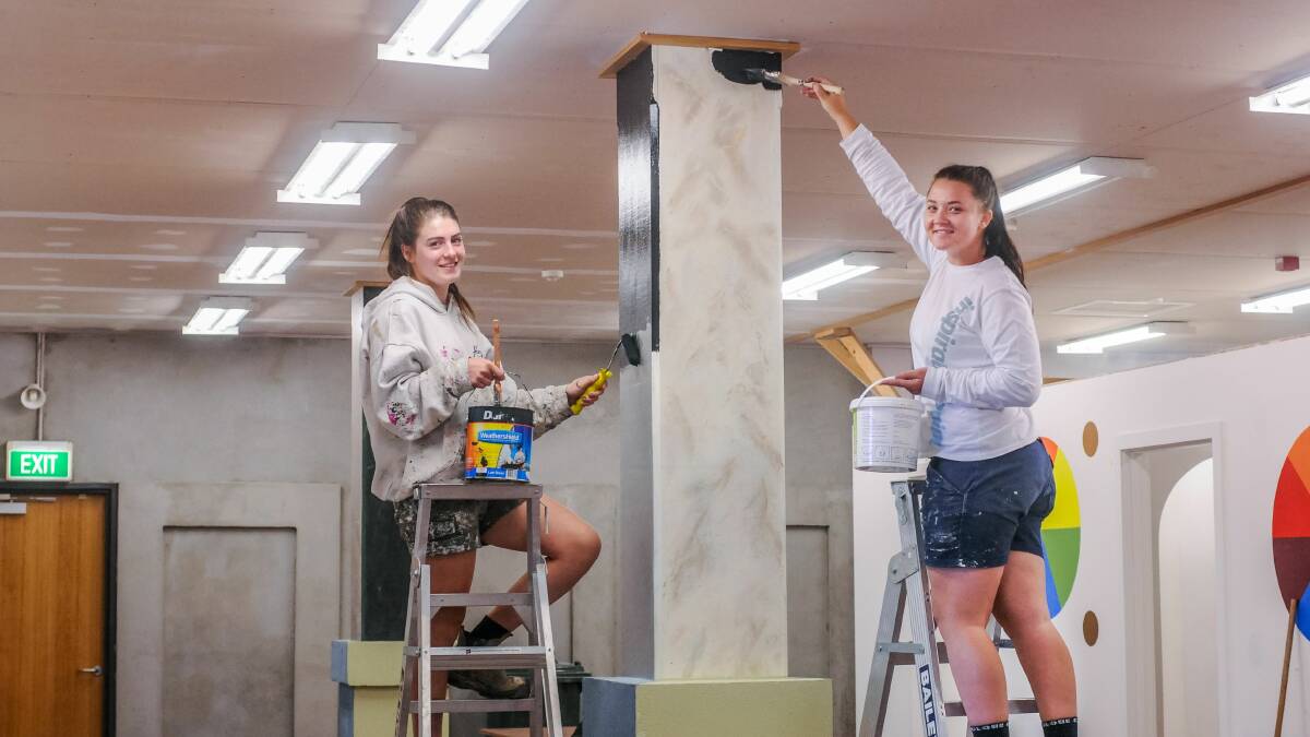 PAINTERS IN TRAINING: Launceston TasTAFE Painting and Decorating Certificate II students Maddison Hill and Tayla Parker practising at the Alanvale campus. Picture: Neil Richardson