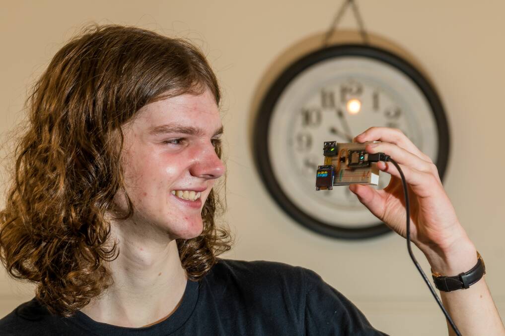 CODE KID: Launceston College grade 12 student Isaac Brain has teamed up with his cousin Mitch Torok, of Hobart, to design a device to assist elderly people after a fall. Picture: Phillip Biggs