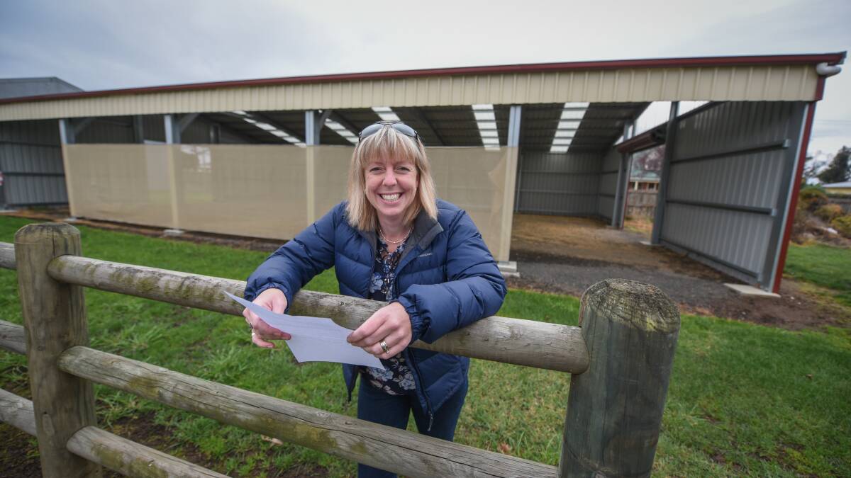 FUTURE PLANS: Longford Show Society secretary Kristy Springer, in front of the sheep shed that will be renovated under the federal government's agricultural show grants, announced earlier this year. Picture: Paul Scambler 