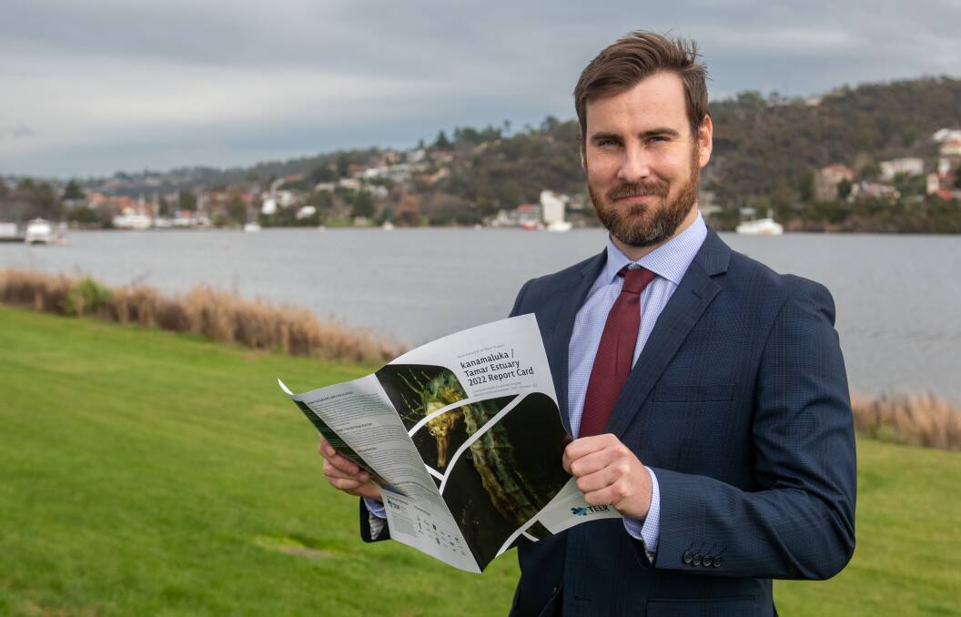 STAYING STILL: Tamar and Esk Rivers program manager Darren McPhee with the 2022 Tamar Estuary Report Card. Picture: Paul Scambler