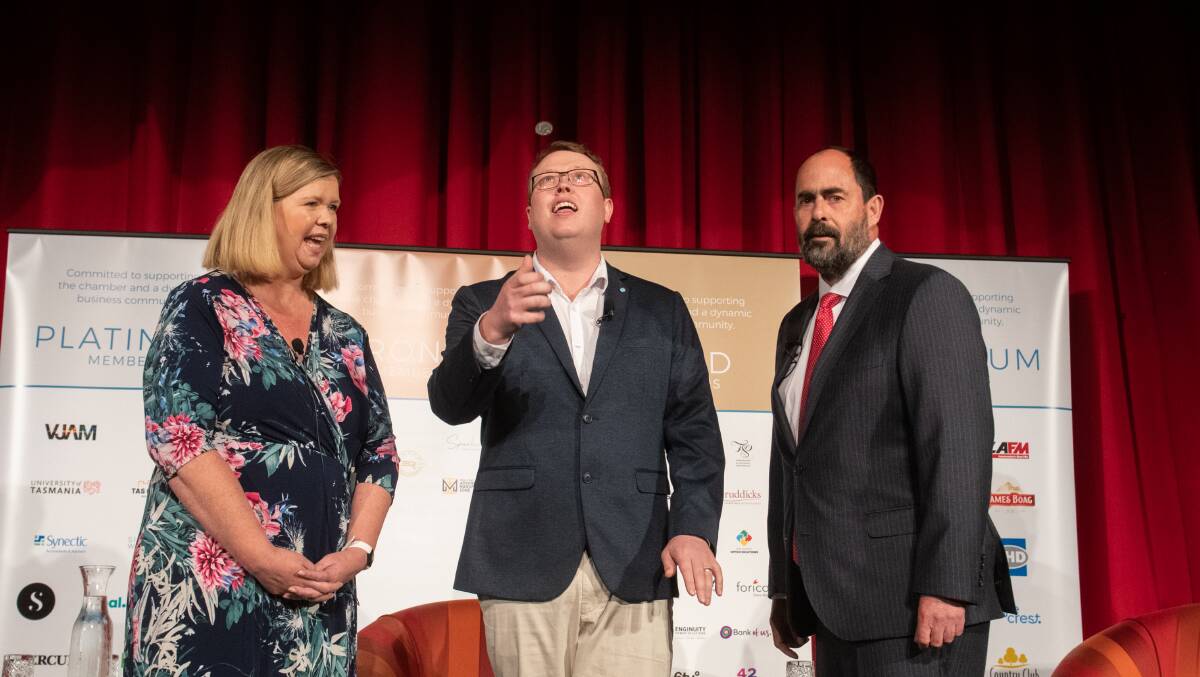 FLIP OF A COIN: Liberal MHR Bridget Archer and Labor candidate Ross Hart with The Examiner editor Corey Martin at the Battle for Bass debate on Thursday night. Pictures: Paul Scambler