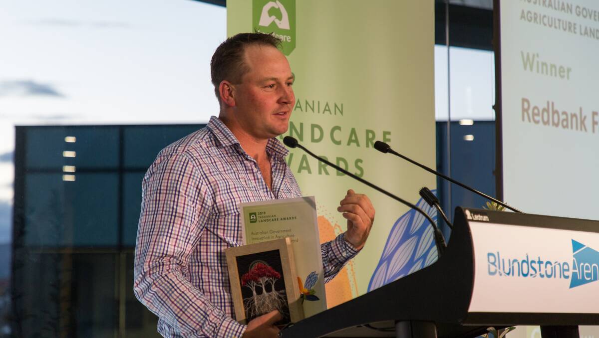 IMPACT: Michael Nichols, of Redbank Farm, accepts the Innovation in Agriculture award at the Landcare Tasmania awards. Picture: supplied
