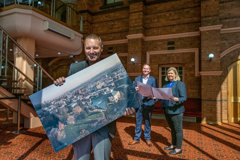 NEW LOOK: Terroir director Scott Balmforth holds the design for the $11 million redevelopment of the Albert Hall with City of Launceston acting Mayor Danny Gibson Bass Liberal MHR Bridget Archer. Picture: Paul Scambler