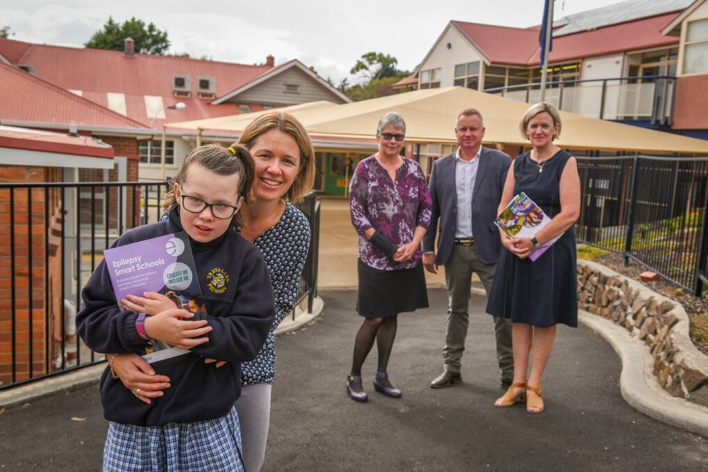 TICK: Sophie Schilg, 11, who has epilepsy, with mum Georgina, Wendy Groot, Jeremy Rockliff and Annette Hollingsworth. Picture: Paul Scambler