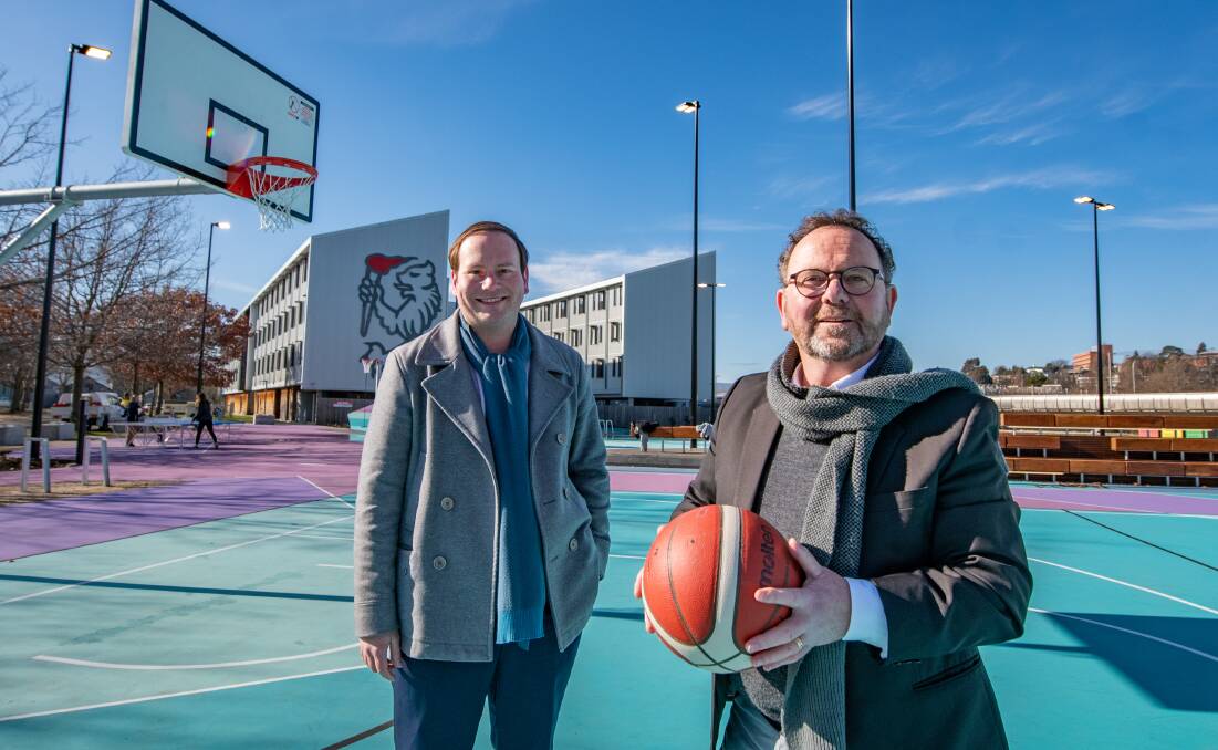 WORK AND PLAY: Acting mayor Danny Gibson and UTAS pro vice chancellor Dom Geraghty on the basketball courts. Pictures: Paul Scambler