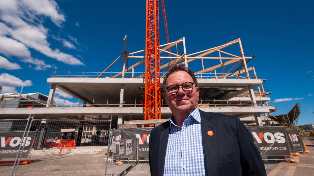 BUILDING UP: UTAS pro-vice-chancellor Dom Geraghty in front of the under-construction library and student experience building at Inveresk. Picture: Phillip Biggs