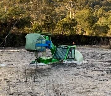 RESCUE: A 56-year-old man has been rescued after his tractor became submerged in floodwaters at Mole Creek on Monday. Picture: Jess Willard