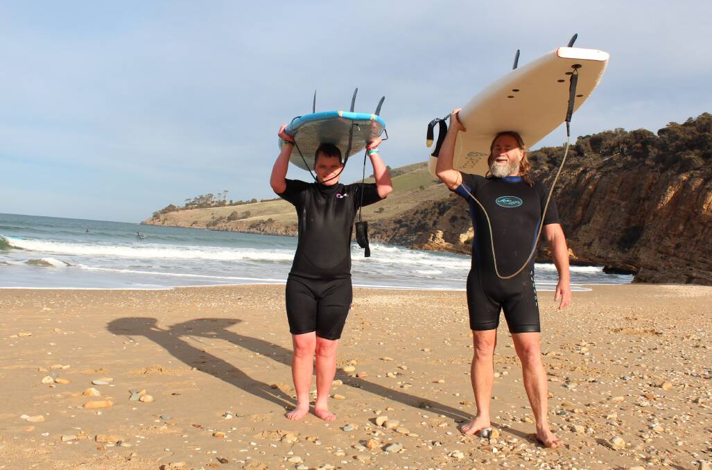 Surf's up: For Aaron Pitcher, who shares his Rosetta home with flat-mates, sport is a big part of his life and aside from bowling he loves heading out surfing with Anglicare support worker Shane Rayner. 