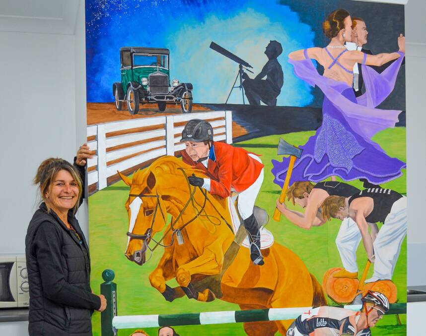 Hall history: Kim Richardson of Bridport with the mural she has installed in the Rosevale Memorial Hall in memory of her father Kevin Cuthbertson. Photo: Lana Best