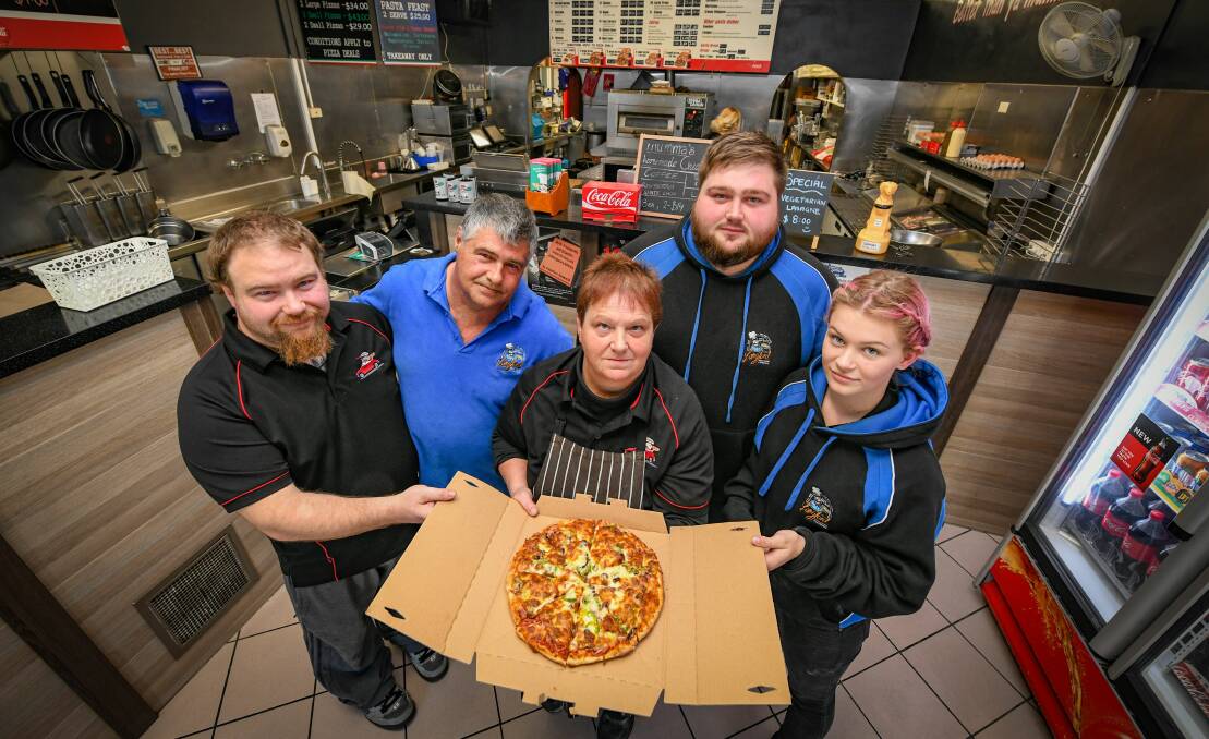 NEW FLAVOUR FOR WATSONS: Italian Pizza House owner Heath Watson, with parents Brett and Christine Watson, brother Brock Watson and niece Taelah Watson. Picture: Paul Scambler